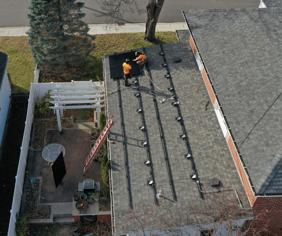 Northwind Solar installers mounting solar panels on a residential rooftop